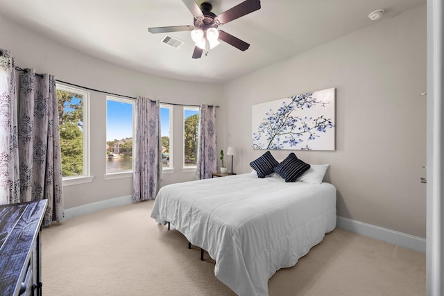 6051 Longmire Trl, Conroe, TX 77304 - bedroom featuring light carpet and ceiling fan