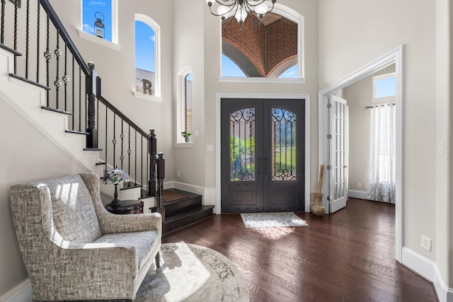 6051 Longmire Trl, Conroe, TX 77304 - entryway featuring a high ceiling, stairway, healthy amount of natural light, and french doors