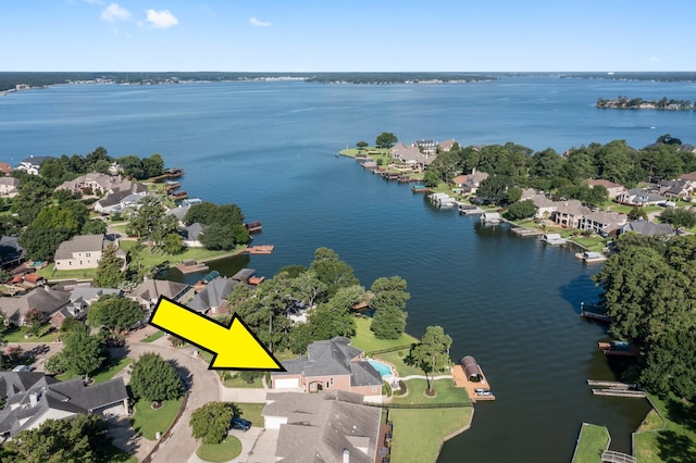 6051 Longmire Trl, Conroe, TX 77304 - aerial view of property and surrounding area with a large body of water and nearby suburban area