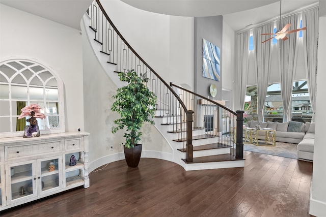 27915 Round Moon Ln, Katy, TX 77494 - stairway featuring a high ceiling, wood finished floors, plenty of natural light, and a ceiling fan