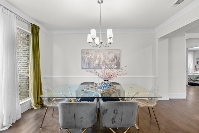 27915 Round Moon Ln, Katy, TX 77494 - dining area featuring a chandelier, wood finished floors, and crown molding