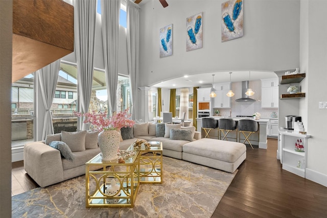 27915 Round Moon Ln, Katy, TX 77494 - living area featuring a high ceiling, dark wood finished floors, and a ceiling fan