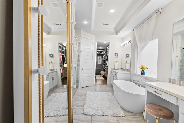 27915 Round Moon Ln, Katy, TX 77494 - full bath with a spacious closet, a freestanding tub, vanity, a stall shower, and recessed lighting