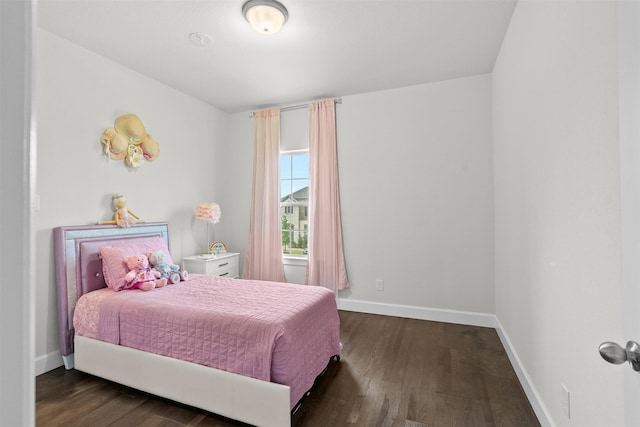 27915 Round Moon Ln, Katy, TX 77494 - bedroom with baseboards and wood finished floors