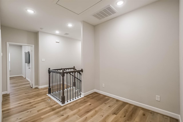 2353 Hoskins Dr, Houston, TX 77080 - corridor featuring light wood-style floors, recessed lighting, an upstairs landing, and attic access