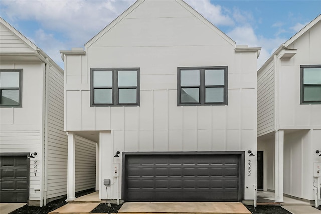 2353 Hoskins Dr, Houston, TX 77080 - view of front facade with board and batten siding and an attached garage