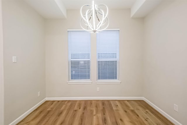 2353 Hoskins Dr, Houston, TX 77080 - spare room featuring a chandelier and light wood-style flooring