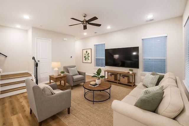 2353 Hoskins Dr, Houston, TX 77080 - living area featuring light wood-type flooring, ceiling fan, recessed lighting, and stairway