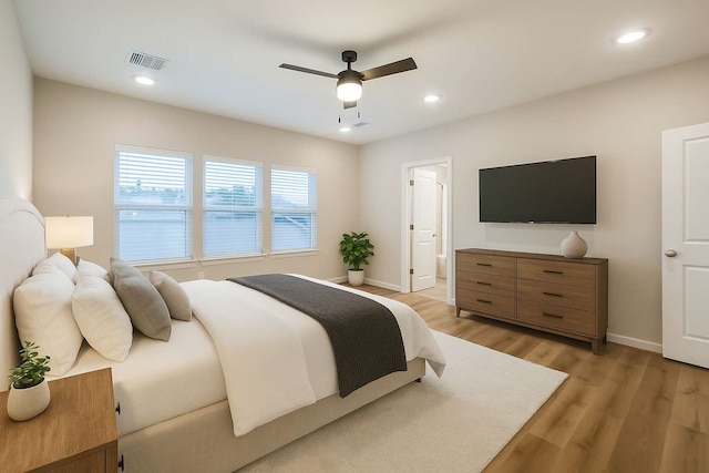 2353 Hoskins Dr, Houston, TX 77080 - bedroom with light wood-style flooring, recessed lighting, a ceiling fan, and connected bathroom