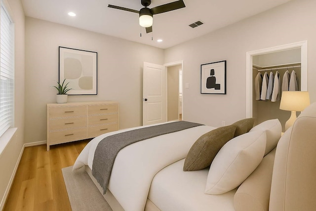 2353 Hoskins Dr, Houston, TX 77080 - bedroom with light wood-type flooring, recessed lighting, ceiling fan, and a closet