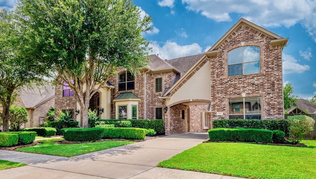407 Pickney Ave, Sugar Land, TX 77479 - french country home with brick siding and a front lawn