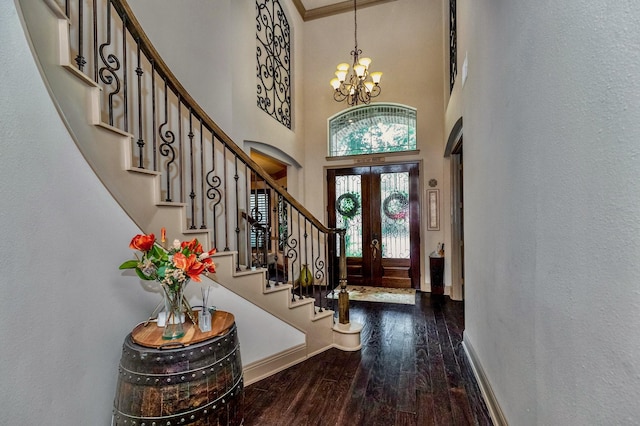 407 Pickney Ave, Sugar Land, TX 77479 - entrance foyer featuring a chandelier, hardwood / wood-style flooring, stairway, a towering ceiling, and french doors