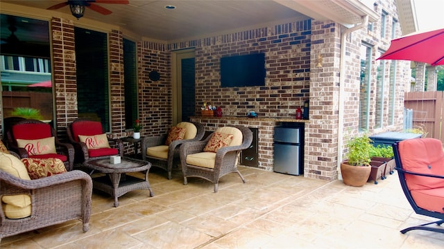407 Pickney Ave, Sugar Land, TX 77479 - view of patio / terrace with a ceiling fan and an outdoor living space with a fireplace