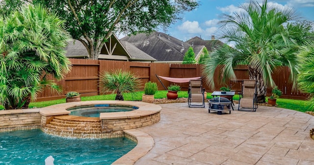 407 Pickney Ave, Sugar Land, TX 77479 - fenced backyard with a patio area, a fire pit, and a pool with connected hot tub