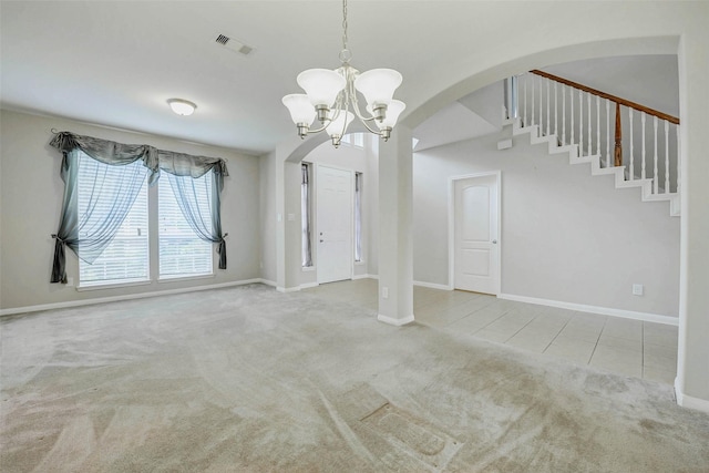 20311 Towering Cypress Dr, Cypress, TX 77433 - unfurnished dining area featuring carpet floors, arched walkways, a chandelier, and stairs