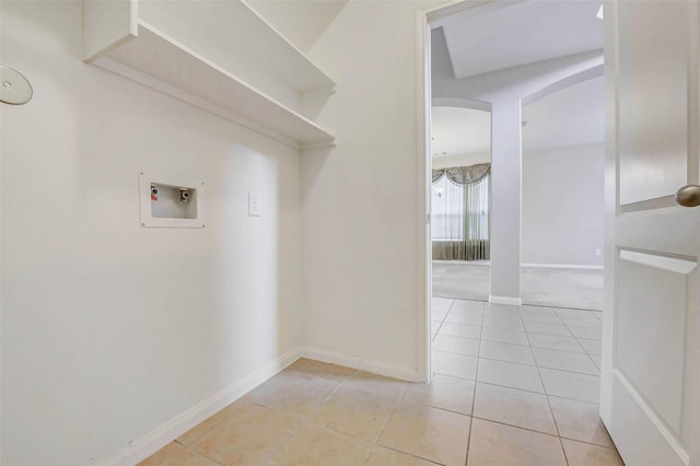 20311 Towering Cypress Dr, Cypress, TX 77433 - laundry room featuring hookup for a washing machine, arched walkways, and light tile patterned floors
