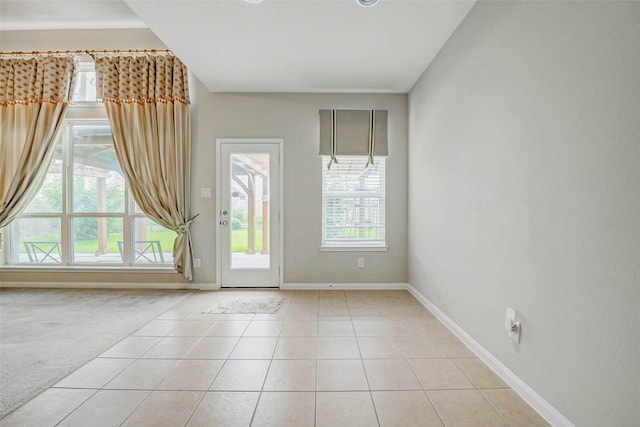 20311 Towering Cypress Dr, Cypress, TX 77433 - empty room with healthy amount of natural light and light tile patterned floors