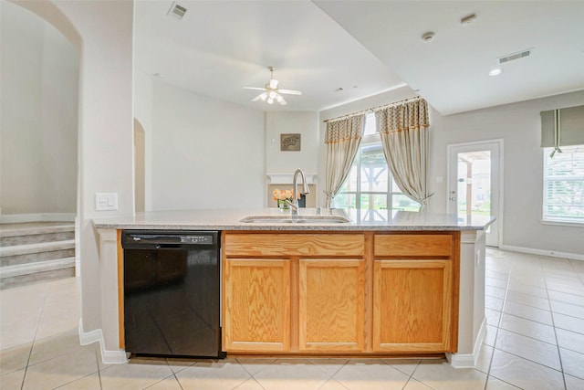 20311 Towering Cypress Dr, Cypress, TX 77433 - kitchen featuring black dishwasher, arched walkways, healthy amount of natural light, and light tile patterned flooring