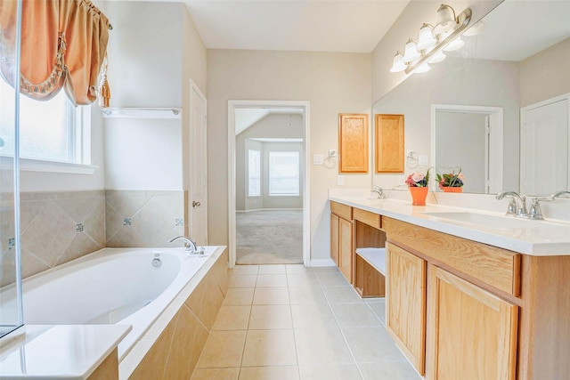 20311 Towering Cypress Dr, Cypress, TX 77433 - bathroom with double vanity, plenty of natural light, a garden tub, and tile patterned floors