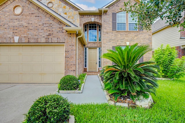 20311 Towering Cypress Dr, Cypress, TX 77433 - view of front of property with concrete driveway, brick siding, and a garage