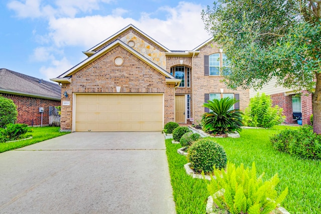 20311 Towering Cypress Dr, Cypress, TX 77433 - view of front of home featuring concrete driveway, brick siding, an attached garage, and a front lawn