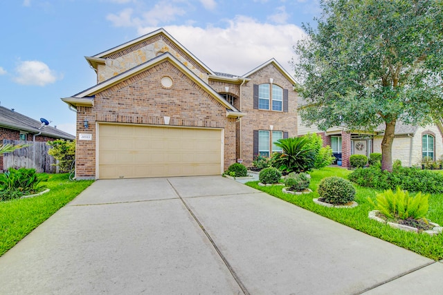 20311 Towering Cypress Dr, Cypress, TX 77433 - view of front of property with brick siding, concrete driveway, and a garage