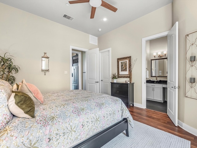 1437 Wagner St, Houston, TX 77007 - bedroom with dark wood-style floors, high end fridge, ensuite bathroom, a chandelier, and recessed lighting
