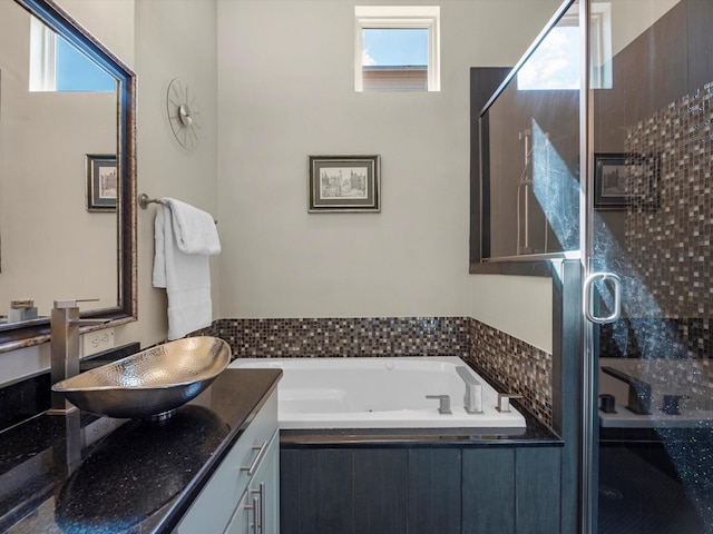 1437 Wagner St, Houston, TX 77007 - full bathroom with healthy amount of natural light, a whirlpool tub, vanity, and a stall shower