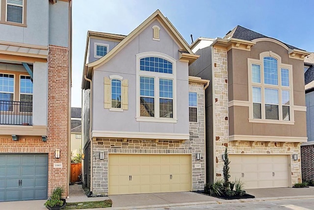 11005 Acorn Falls Dr, Houston, TX 77043 - view of front of home featuring stone siding, stucco siding, and an attached garage