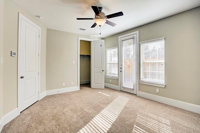11005 Acorn Falls Dr, Houston, TX 77043 - unfurnished bedroom featuring carpet, access to outside, ceiling fan, and a spacious closet