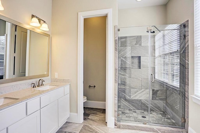 11005 Acorn Falls Dr, Houston, TX 77043 - full bath featuring a stall shower, double vanity, and marble finish flooring