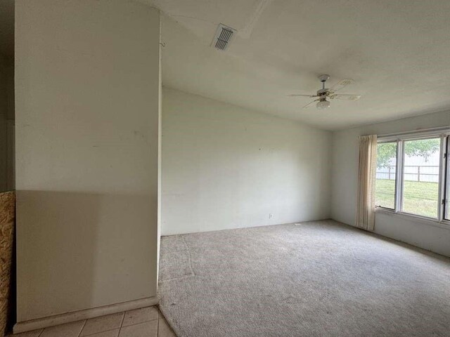 4425 Woodrow Rd, Lubbock, TX 79424 - unfurnished room featuring a ceiling fan, light carpet, and lofted ceiling