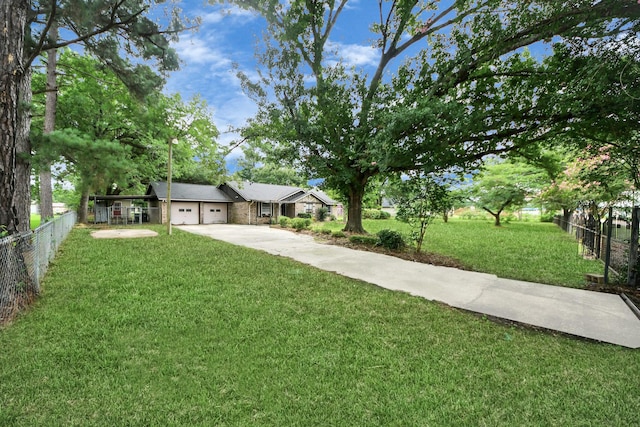30718 N Cripple Creek Dr, Magnolia, TX 77354 - view of front facade with concrete driveway and a garage