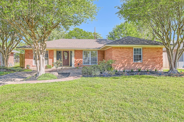2018 Wakefield Dr, Houston, TX 77018 - ranch-style house with brick siding and a front yard