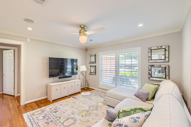 2018 Wakefield Dr, Houston, TX 77018 - living room featuring light wood-style flooring, ceiling fan, crown molding, and recessed lighting