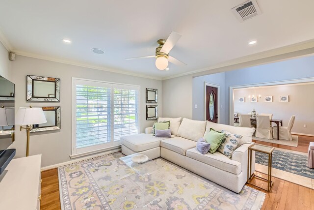 2018 Wakefield Dr, Houston, TX 77018 - living area with ceiling fan, wood finished floors, crown molding, and recessed lighting