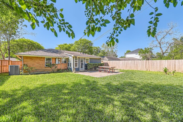 2018 Wakefield Dr, Houston, TX 77018 - rear view of property with a fenced backyard, a patio area, and brick siding