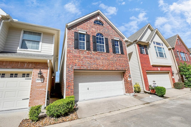2640 Couch St, Houston, TX 77008 - traditional-style house with a garage, driveway, and brick siding