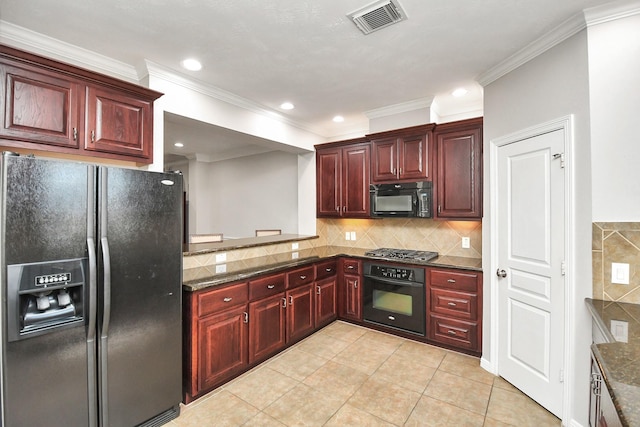 2640 Couch St, Houston, TX 77008 - kitchen with black appliances, reddish brown cabinets, crown molding, light tile patterned flooring, and decorative backsplash