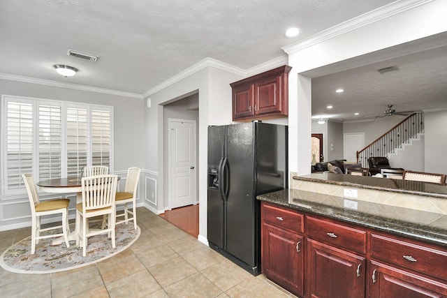 2640 Couch St, Houston, TX 77008 - kitchen featuring black refrigerator with ice dispenser, dark brown cabinets, light tile patterned floors, ceiling fan, and ornamental molding