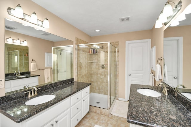2640 Couch St, Houston, TX 77008 - bathroom featuring a stall shower and two vanities