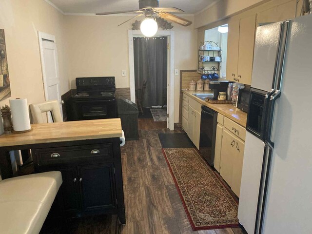 1305 E Goliad Ave, Crockett, TX 75835 - kitchen with white refrigerator with ice dispenser, dark wood finished floors, black dishwasher, ornamental molding, and a ceiling fan