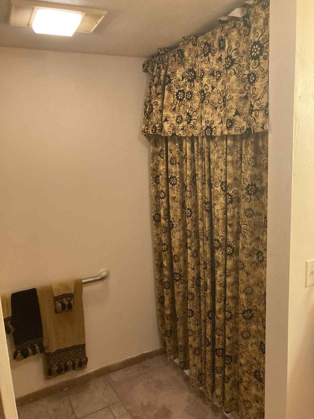 1305 E Goliad Ave, Crockett, TX 75835 - full bathroom with tile patterned floors and curtained shower