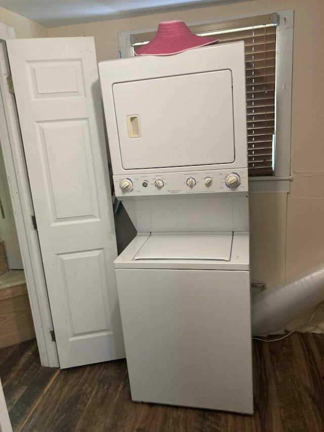 1305 E Goliad Ave, Crockett, TX 75835 - washroom featuring stacked washer / drying machine and dark wood finished floors