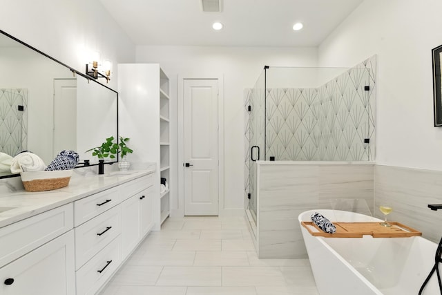 3913 Hare St, Houston, TX 77020 - full bathroom with double vanity, a freestanding bath, a shower stall, and a chandelier