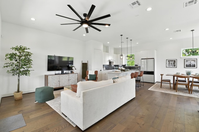 3913 Hare St, Houston, TX 77020 - living room featuring recessed lighting, ceiling fan, and dark wood-type flooring