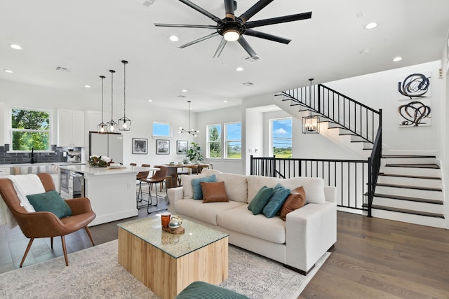 3913 Hare St, Houston, TX 77020 - living area featuring recessed lighting, healthy amount of natural light, ceiling fan, and wood finished floors