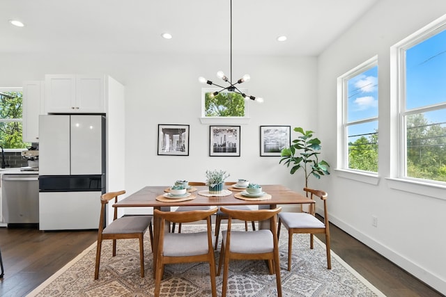 3913 Hare St, Houston, TX 77020 - dining area with dark wood-type flooring, a chandelier, and recessed lighting