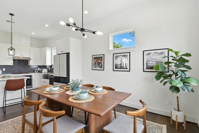3913 Hare St, Houston, TX 77020 - dining room with dark wood finished floors, recessed lighting, and a chandelier
