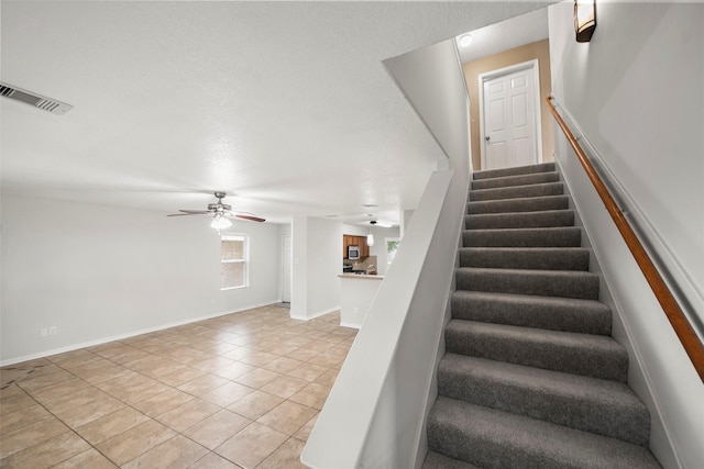 4838 Fair Oak Dale Ln, Humble, TX 77346 - staircase featuring tile patterned floors and a ceiling fan